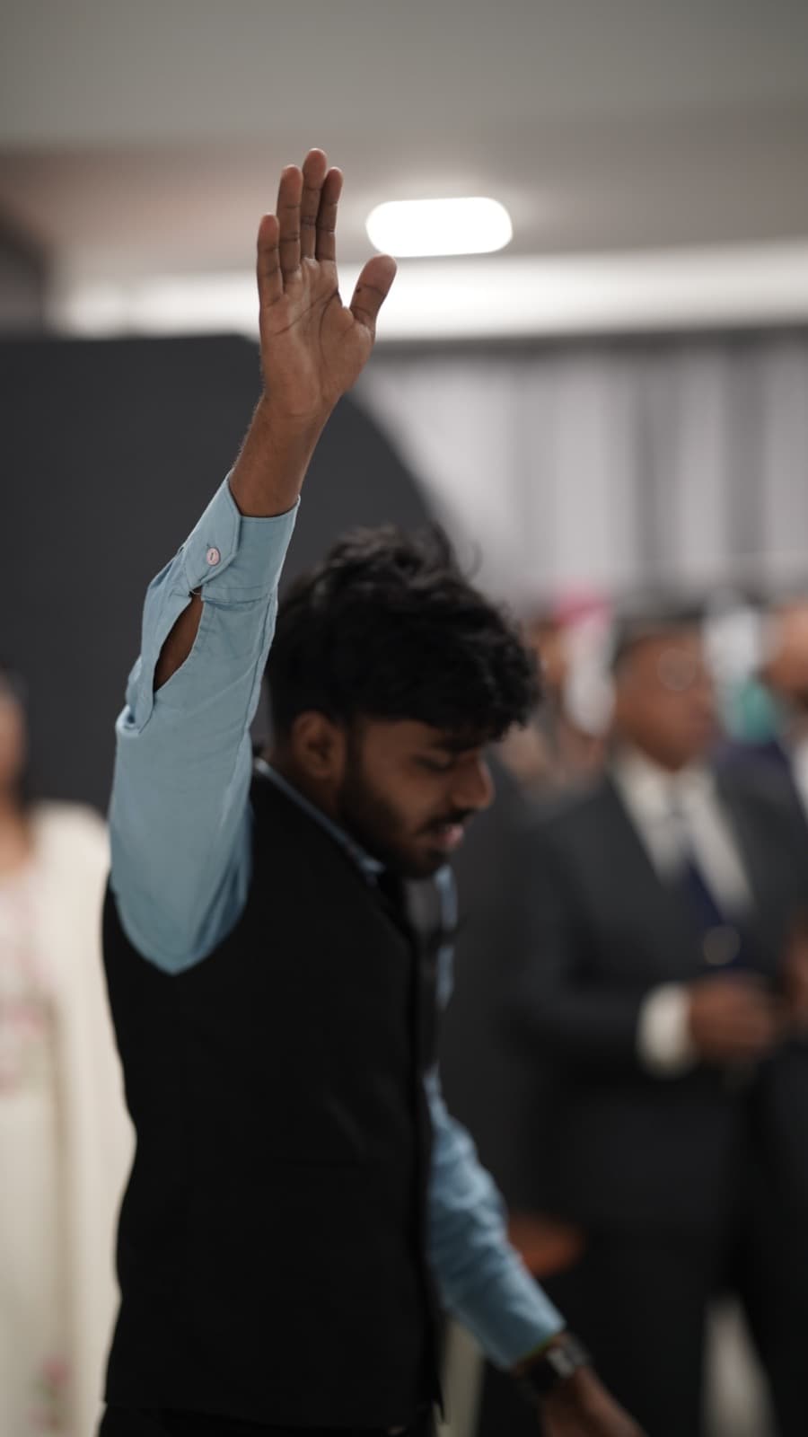 A young man worshipping