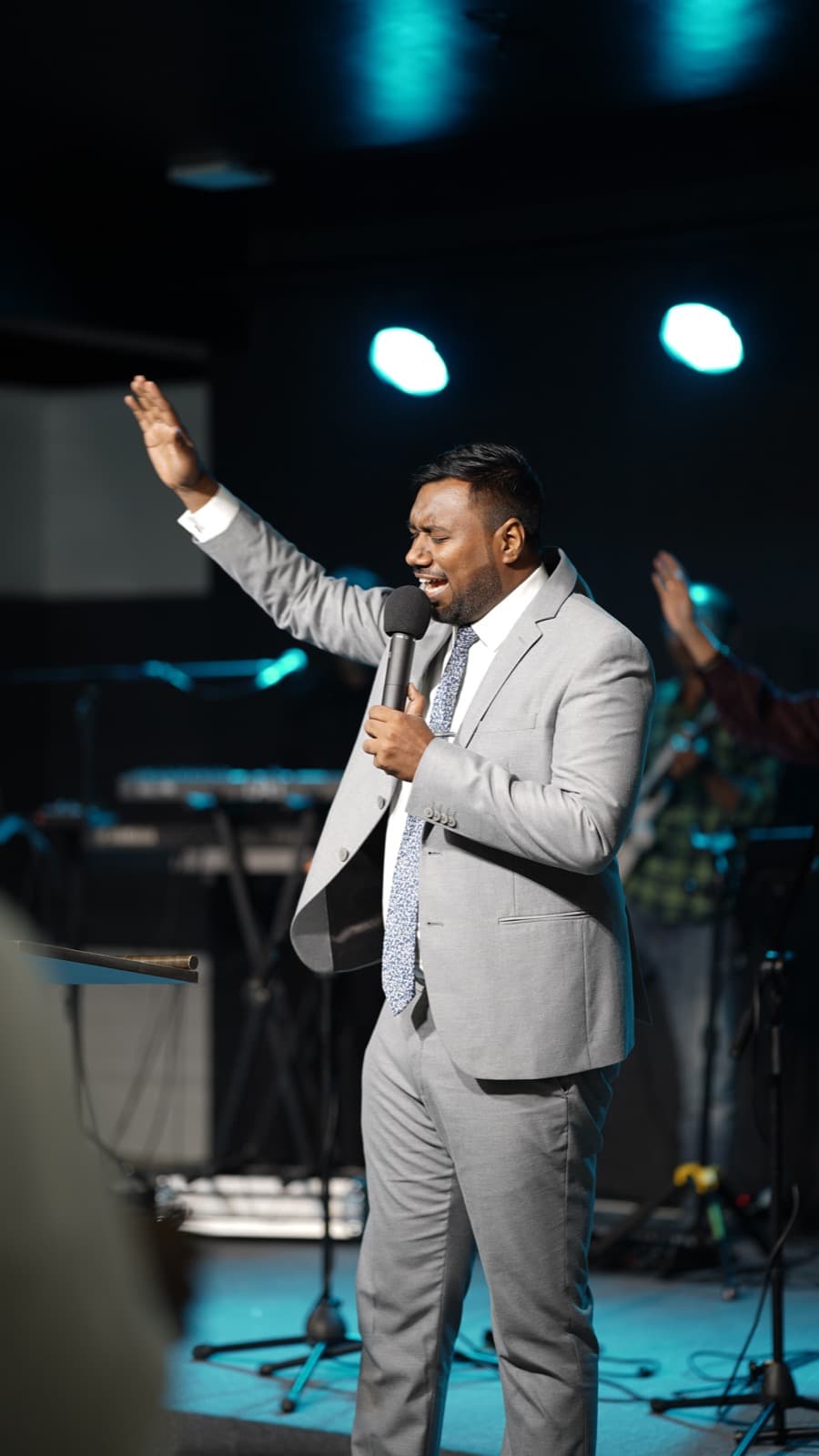Pastor Presty preaching on a Sunday